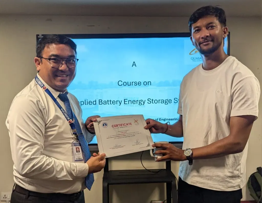 Sandip Paudel receiving a certificate of appreciation from Khwopa College of Engineering for delivering the Applied Battery Energy Storage Systems training